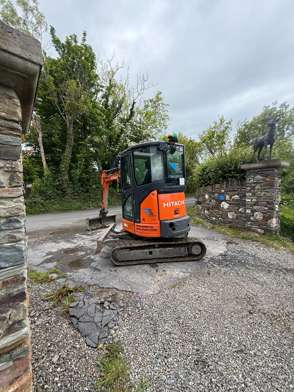 HPM Hitachi mini excavator breaking out driveway Isle of Man