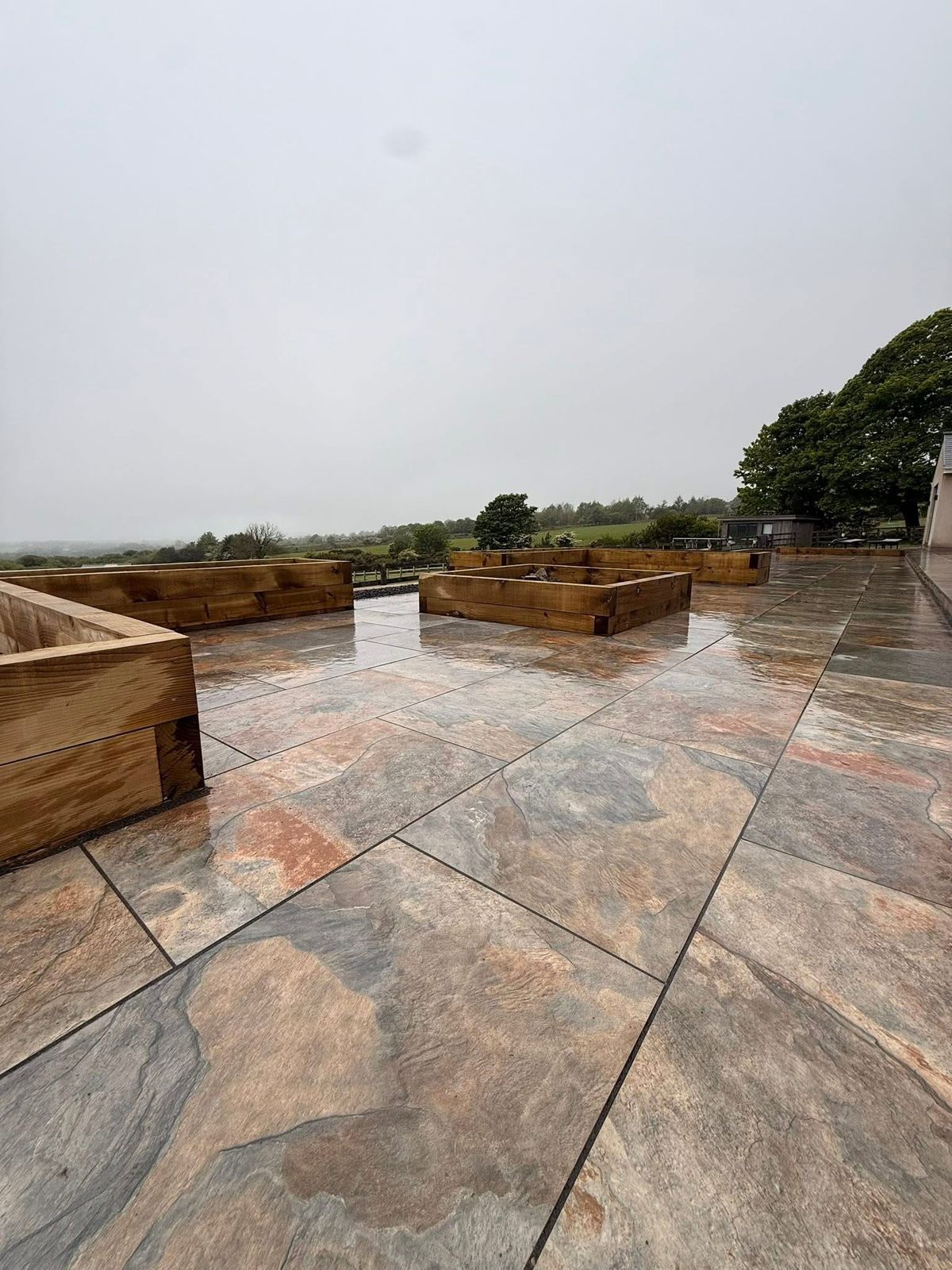 Large slate-effect porcelain patio installed on the Isle of Man